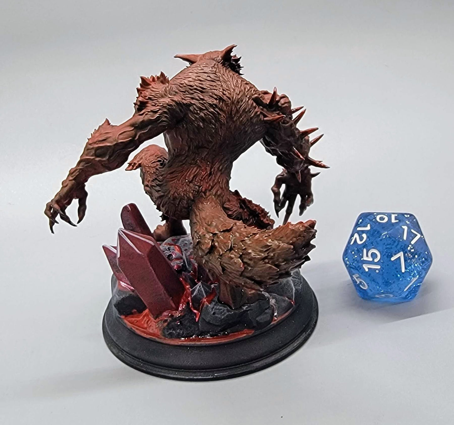 Bloodclaw Abominable Werewolf large sized resin miniature with spiked arm and feral snarl on a rocky base, perfect for TTRPG boss encounters.
