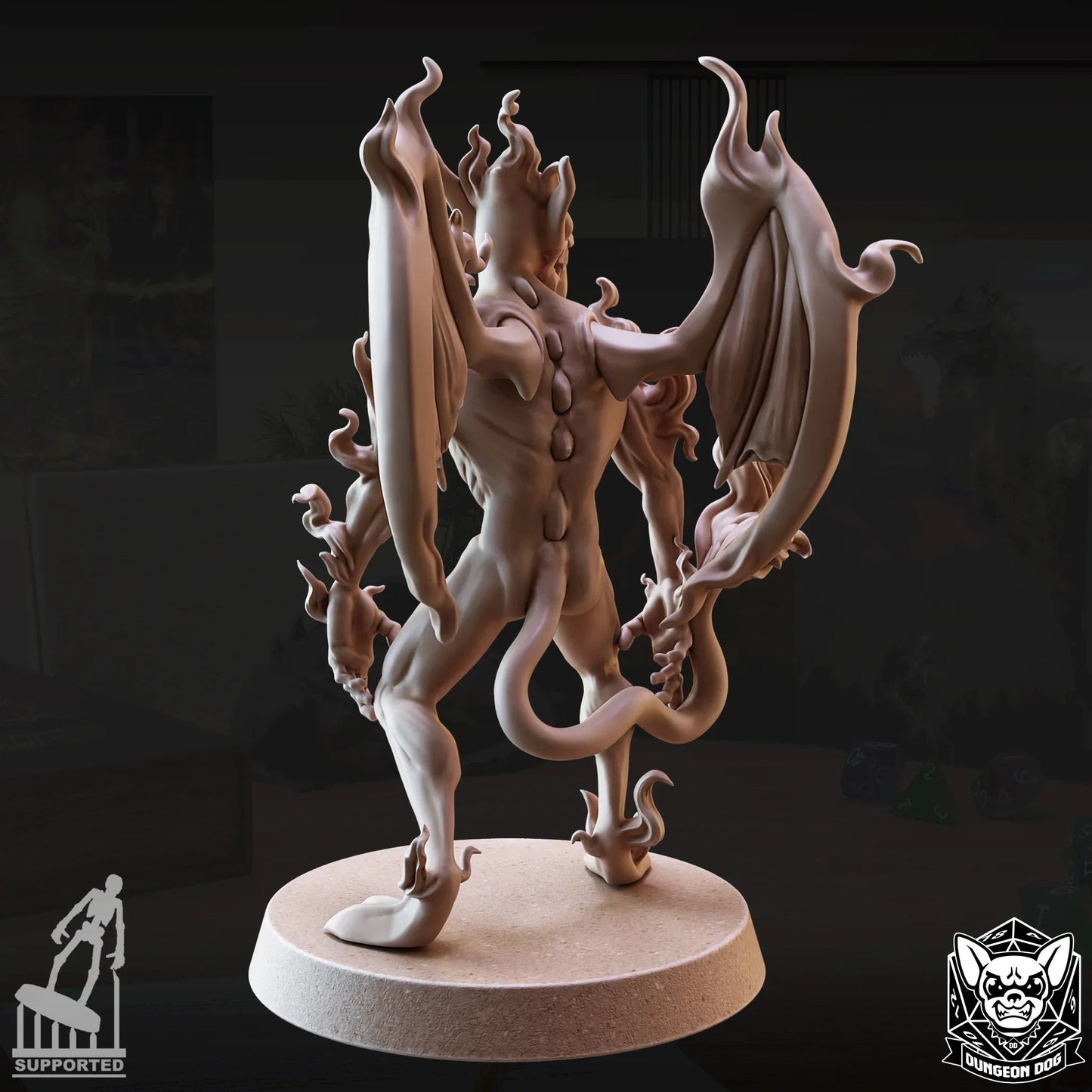 Rear view of Fire Mephit miniature showing back spine, wings, and tail sculpted in resin