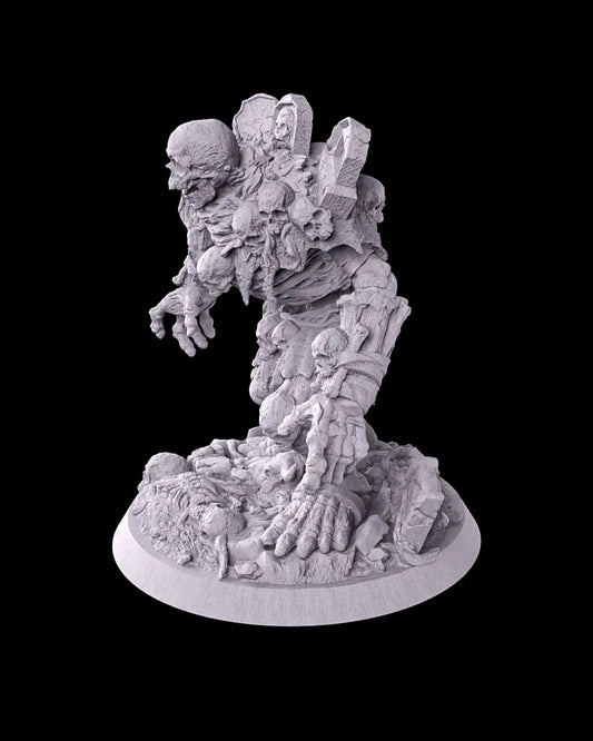 Side view of unpainted Tombstone Golem miniature showing skeletal arm and detailed rocky graveyard base.