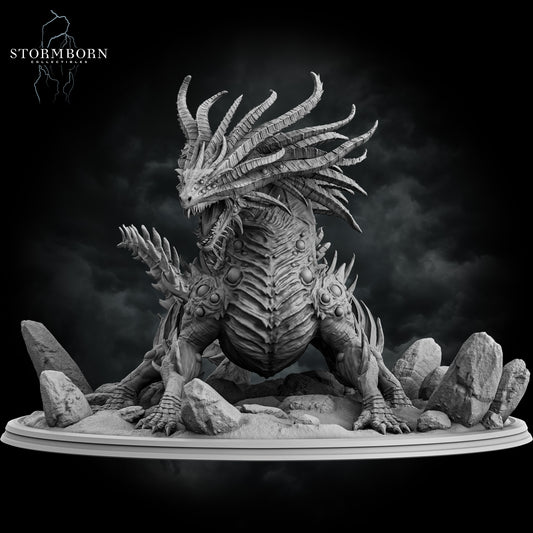 Frontal view showing the six-legged stance and crown of horns on the Basilisk King miniature by Stormborn Collectibles.