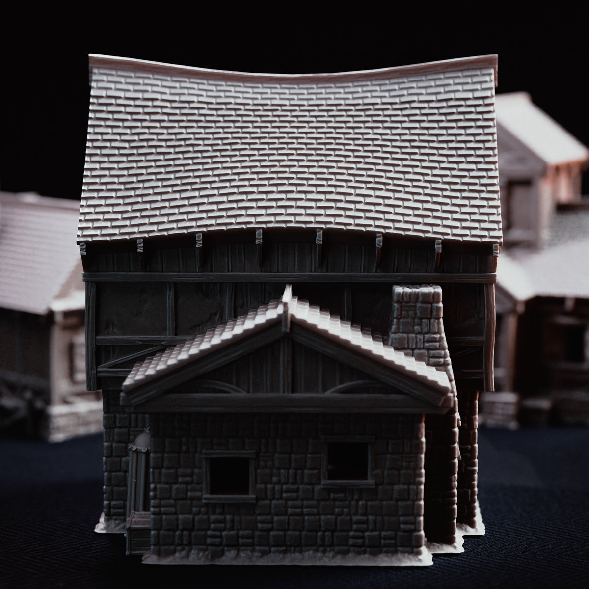 Rear view of the Hangman's Cottage displaying stone chimney stack and rear lower extension.