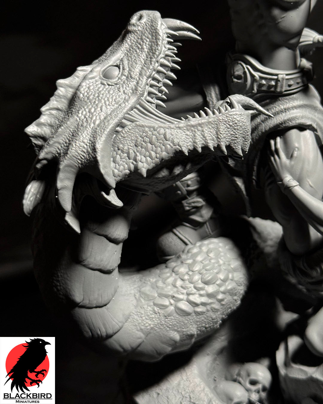 Close-up of the printed basilisk head showing its open jaws, teeth, scales, and reptilian surface texture.