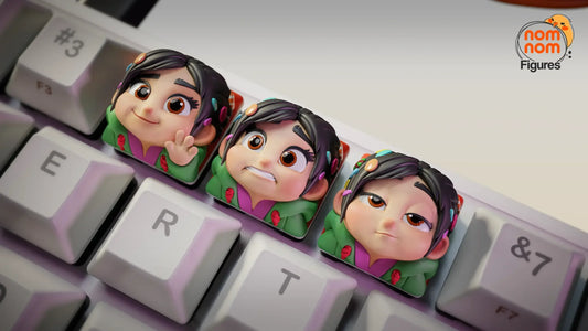Vanellope Von Schweetz keycap trio on white mechanical keyboard