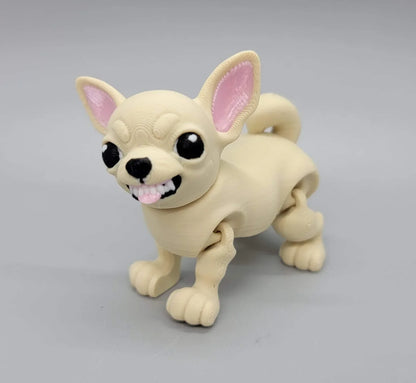 3D printed articulated Chihuahua toy in beige with expressive face, showing cartoon-style teeth and tongue – poseable dog figure with big eyes.