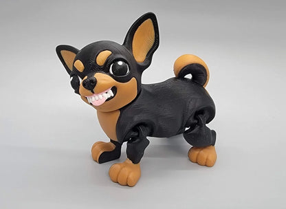 3D printed articulated Chihuahua toy in black and tan with cartoon-style crazy teeth expression – poseable dog figure with bold facial features.