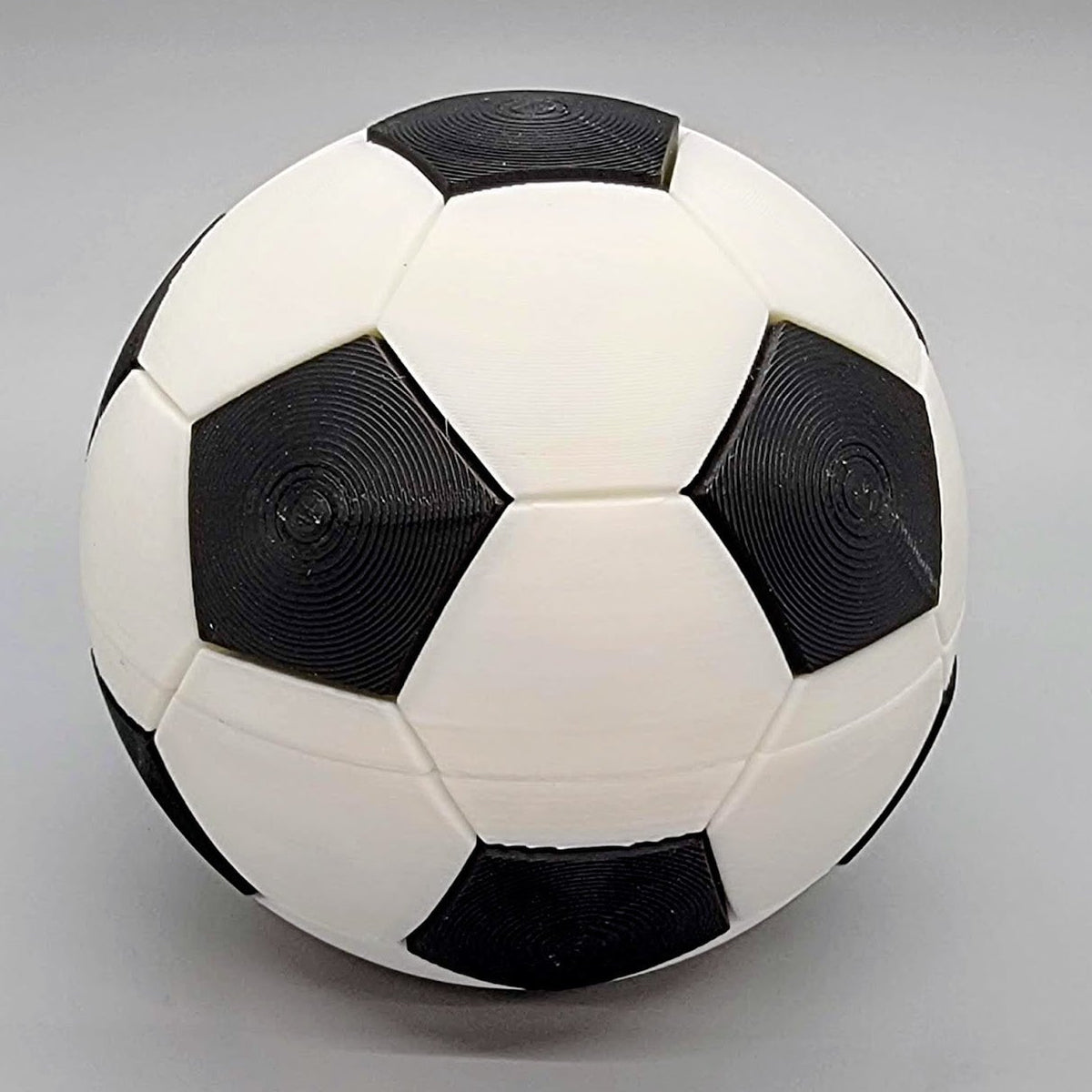 3D printed black and white soccer clicker ball with 12 hexagon clickers