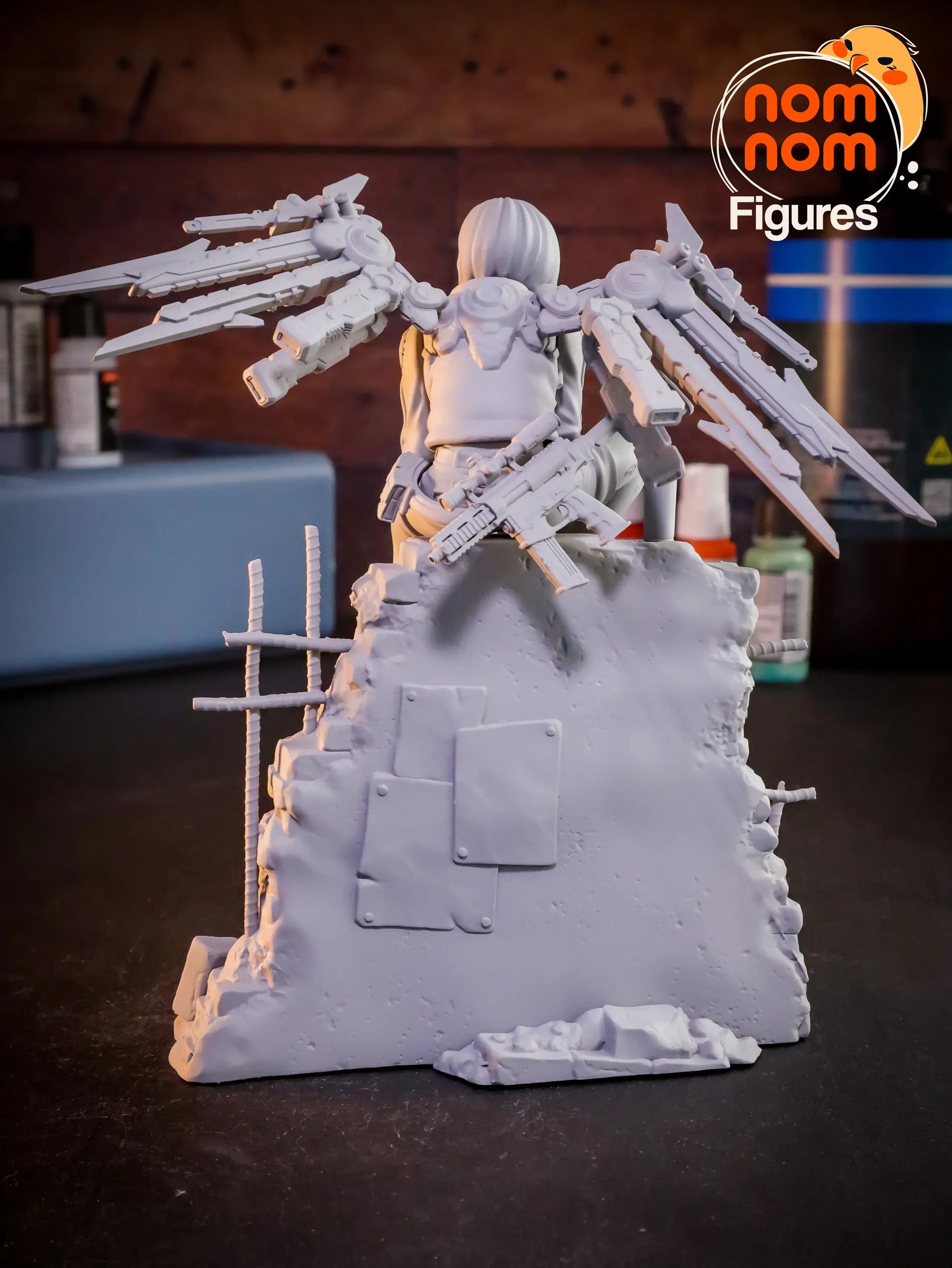 Valrie figure from behind showing tech wings and detailed wall texture, gray resin 3D print.