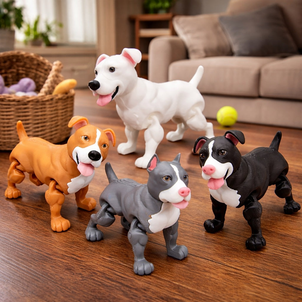 Four articulated pit bull dog toys in brown and white, solid white, gray and white, and black and white color variants, featuring poseable legs and expressive faces, displayed on a wooden living room floor with a couch, dog toy basket, and tennis ball in the background.