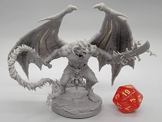 Resin-printed Balor Vogron demon miniature with wings, swords, and flame tail next to D20 die – 32mm or 75mm scale boss for DnD, Pathfinder, and TTRPG display
