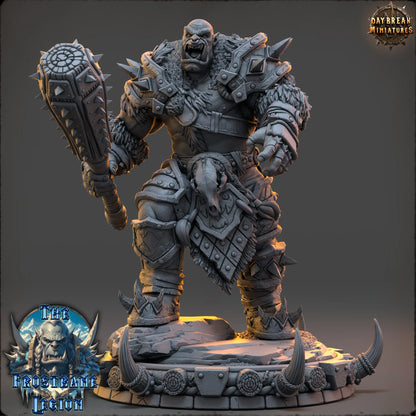 Massive armored frost orc wielding spiked club on scenic base by Daybreak Miniatures, resin TTRPG boss miniature for wargaming or RPG encounters.