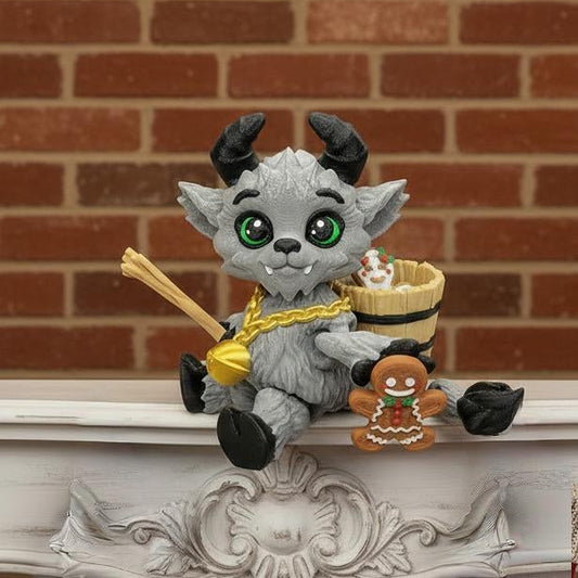 Chibi Krampus articulated fidget toy featuring a gray fur body with black horns, black hooves, bright green eyes, and festive accessories. Fully posable design for fidgeting or display. Custom color options available. Great as a collectible toy, desk fidget, or unique gift.