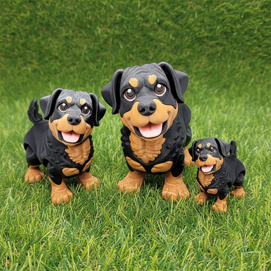 Three articulated chibi Rottweiler dog toys in small, medium, and big sizes displayed on grass, showing black and tan coloring with poseable heads and legs, 3D printed fidget toys for dog lovers