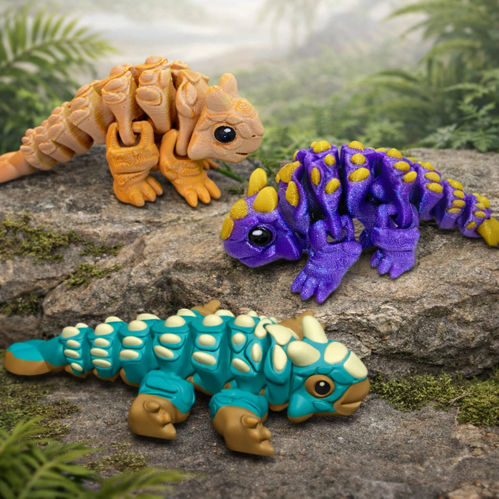 Custom ankylosaur dinosaur toy featuring three articulated 3D printed ankylosaur figures in teal purple and tan with textured armor plates and flexible joints displayed on a neutral prehistoric style background for play display or gifts