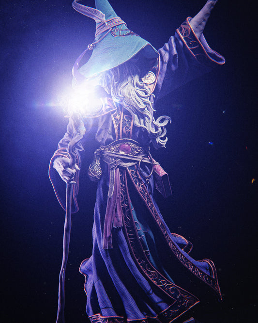 Fantasy character in a blue robe and hat with glowing light, against a dark background