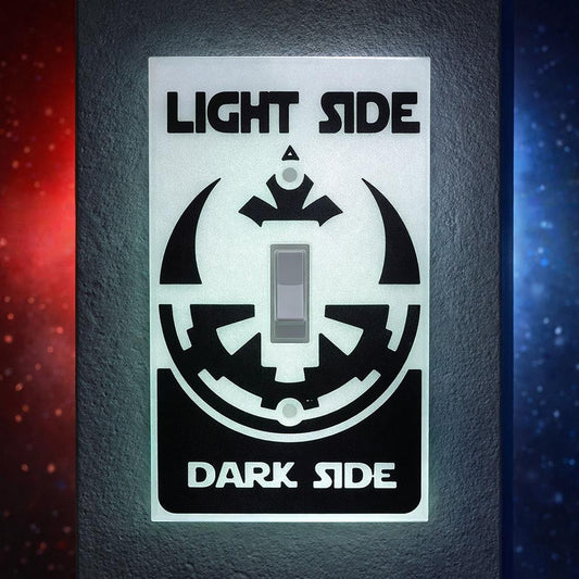 Light switch cover with 'Light Side' and 'Dark Side' design on a dark background