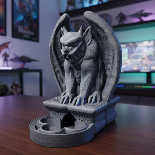 Gray gargoyle statue on a stand in a room with computer monitors and posters.
