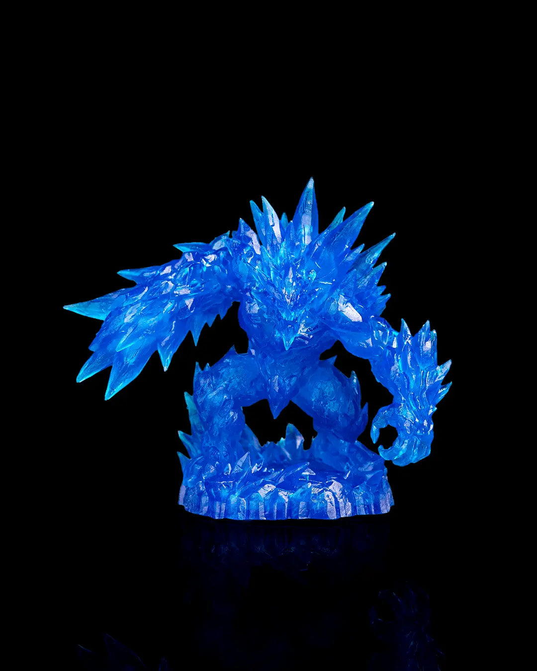 Blue crystal-like figurine on a black background