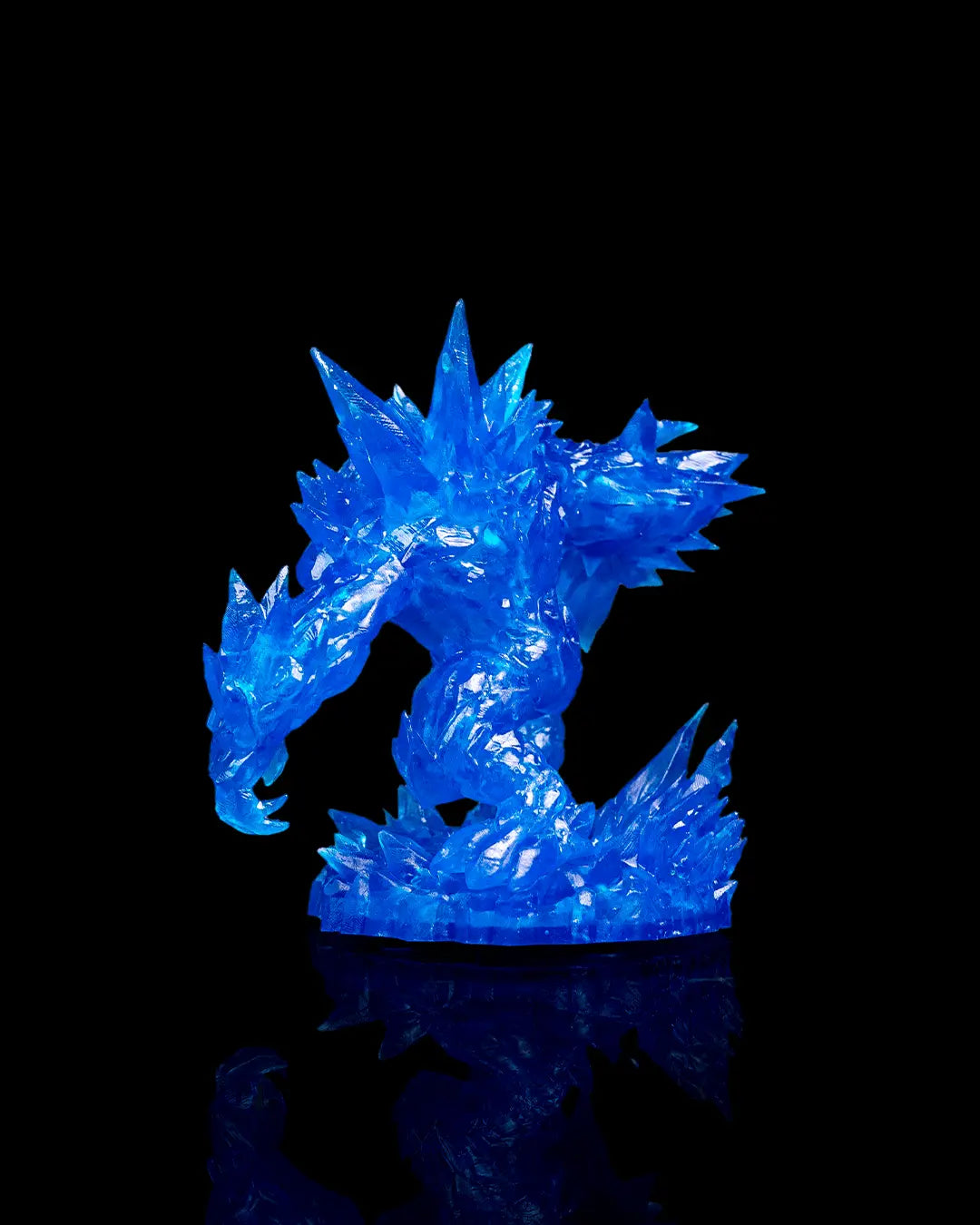 Blue crystal-like dragon figurine on a black background