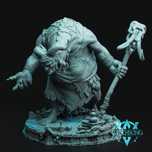 Resin miniature of The Horned Witch with horned head, ragged robes, and staff topped with skull – giant boss monster for TTRPGs.