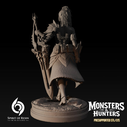Ambra, Supervisor of the Expedition resin miniature by Spirit of Resin Miniatures, a female huntress in survival armor wielding a massive ornate greatsword shown from the back.