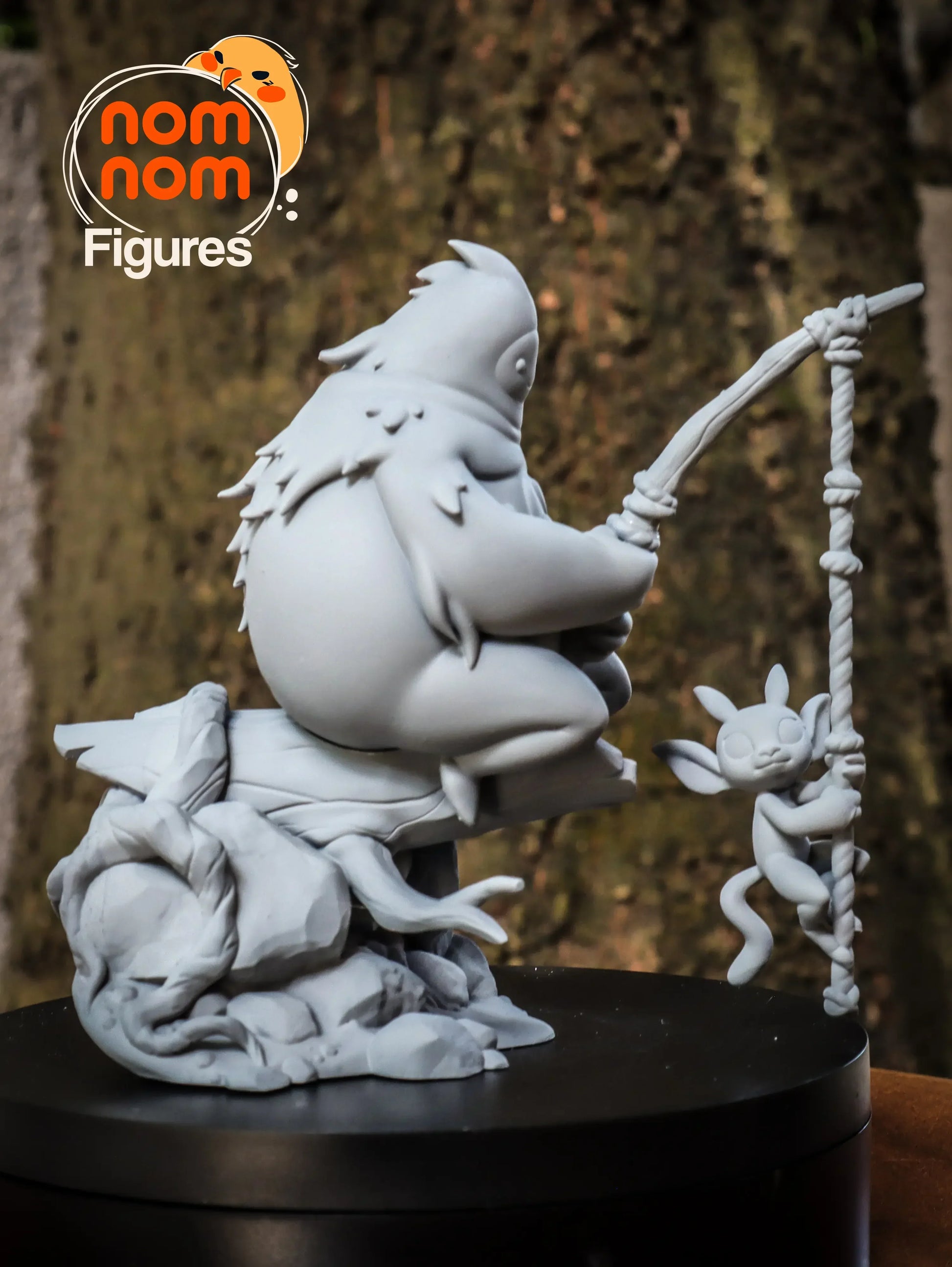 Side view of Nom Nom Figures Chibi Fishing Creature with hanging companion, 116mm resin statue.
