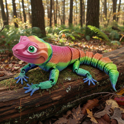 Articulated leopard gecko toy posed on a mossy log in a forest setting, featuring bright rainbow colors, flexible segmented body, and detailed reptile texture.