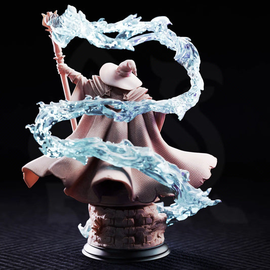 Rear view resin mini of Merlin of Monmouth showcasing textured cape and 360-degree spell effect trail.
