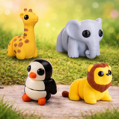 Four mini zoo animal toy figures displayed outdoors on grass and stone, including a yellow giraffe with brown spots, a gray elephant, a black and white penguin with orange beak and feet, and a yellow lion with a brown mane