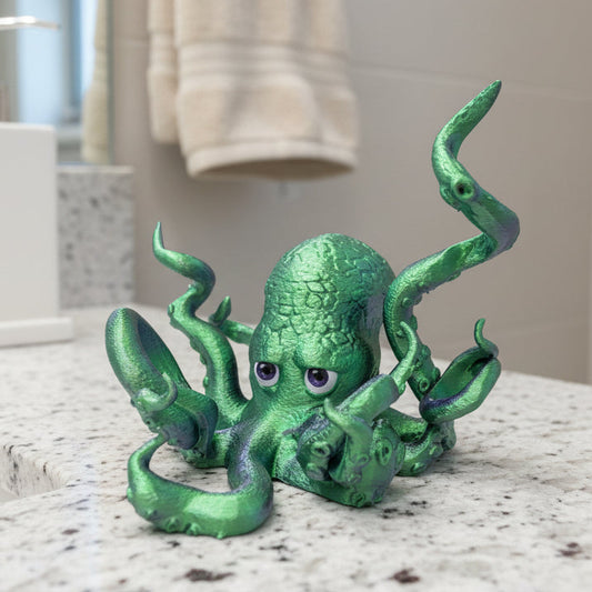 Green 3D printed octopus toothbrush holder with expressive eyes and customizable arm positions, ideal for fun bathroom decor.