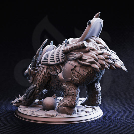 Detailed fantasy owlbear creature figurine on a dark background