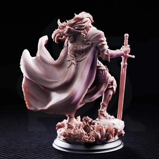 Rear view resin mini of Prince Charming showing large rose emblem on cloak and blowing cape.