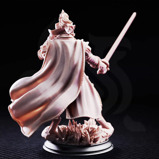 Rear view resin mini of Puss In Boots showcasing flowing cape and feather in hat.