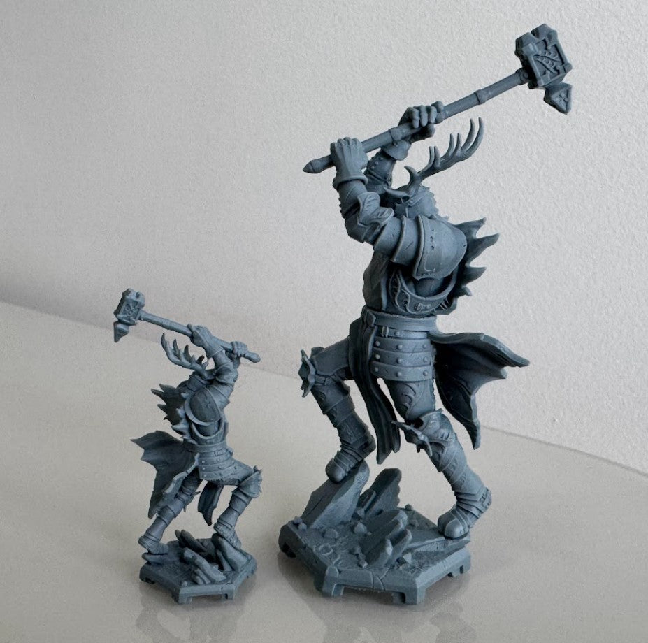 Both scales shown in comparison side profiles of Royal Crusher resin miniature in heavy plate armor with stag horn crest and warhammer.