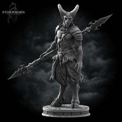 A straight-on view of the Satyr warrior miniature by Stormborn Collectibles, showing the double-headed spear and ornate shoulder armor on a cobblestone base.