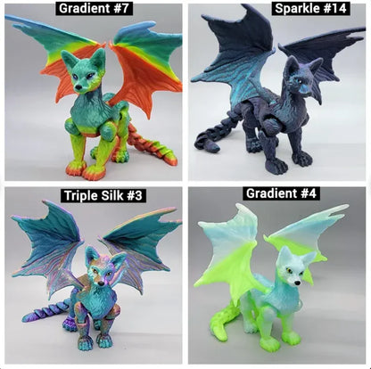 Winged Cat Dragon toys in four filament styles – Gradient #7 (red-orange/green/blue), Sparkle #14 (dark blue shimmer), Triple Silk #3 (metallic teal-purple), and Gradient #4 (neon green and ice blue), 3D printed articulated fantasy figures.