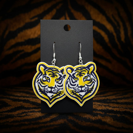 Tiger earrings on a black card 