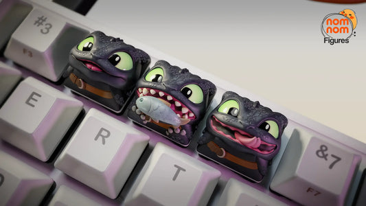 Digital render of a Close-up of the three Toothless dragon keycaps on keyboard