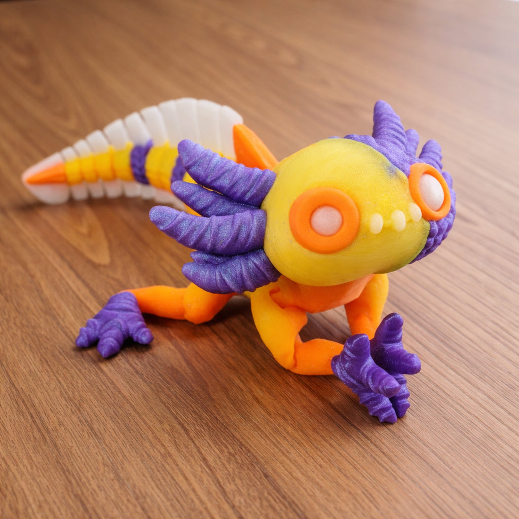Colorful articulated axolotl toy on a brown surface