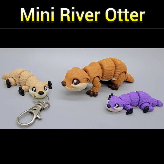 Mini juguete o llavero de nutria de río