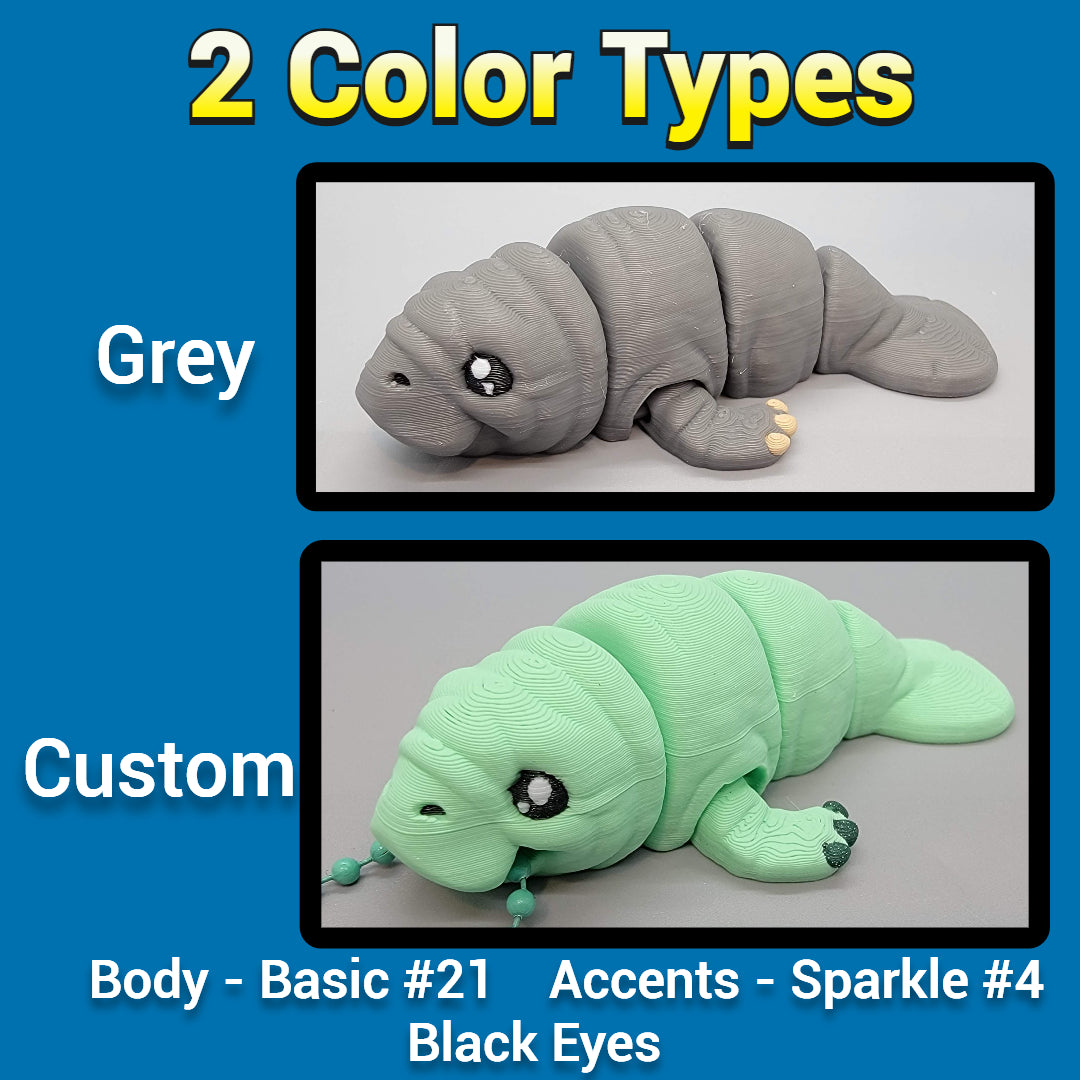 Two manatee toys, one gray and one custom green with black eyes, on a blue background.