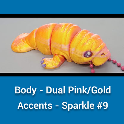 Color swatch with a manatee toy body in dual pink/gold and text indicating color code.