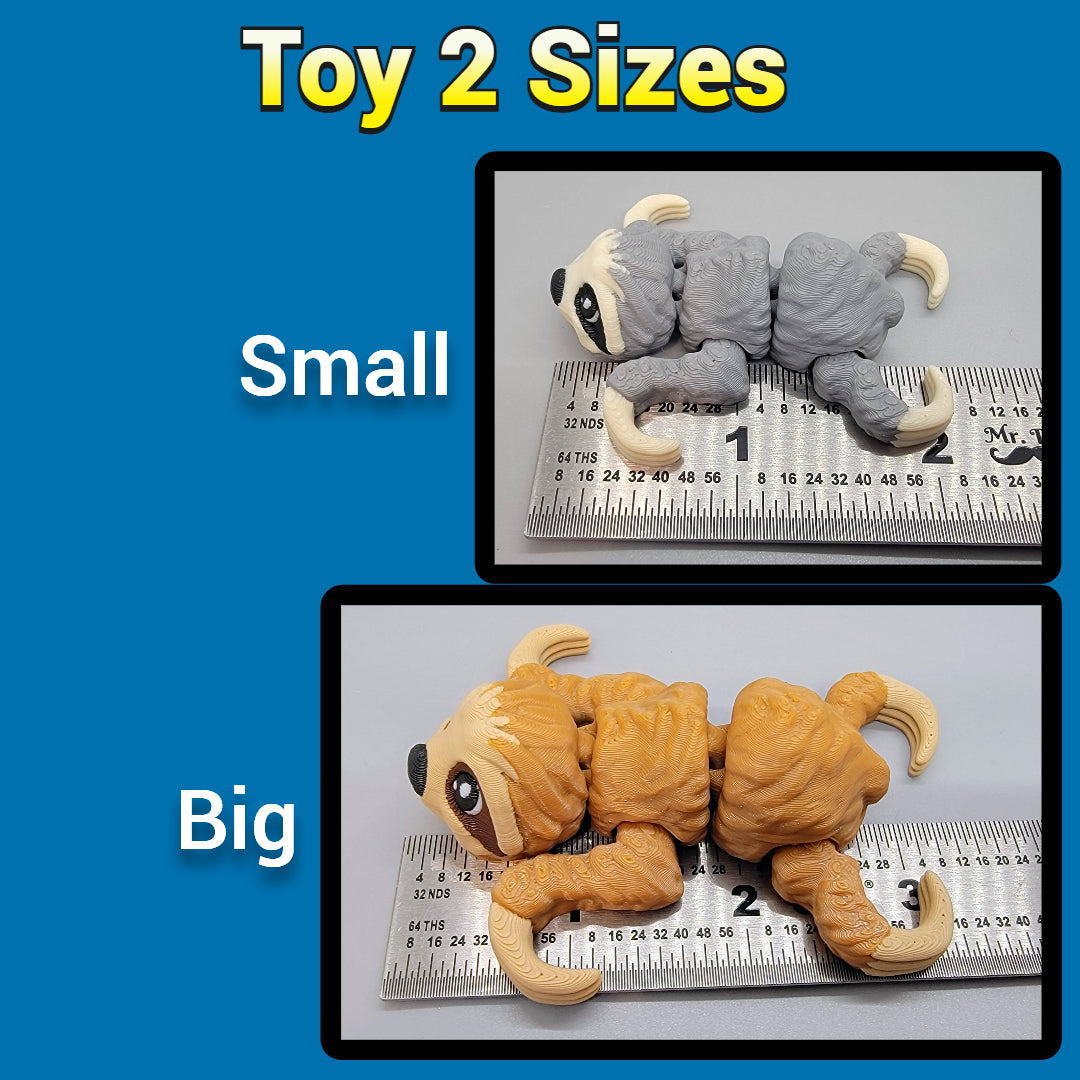 Two sloth toys, one small and one big, next to a ruler on a blue background.