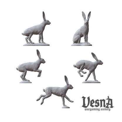 Detailed view of five individual rabbit miniature sculpts including alert and sprinting poses.
