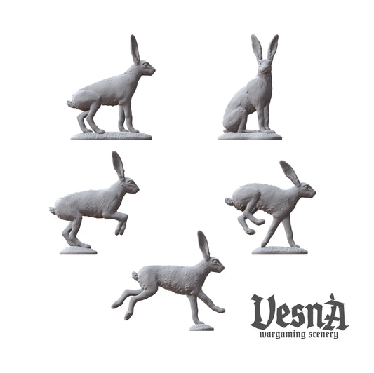 Detailed view of five individual rabbit miniature sculpts including alert and sprinting poses.