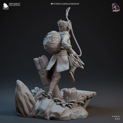 Back view of Zoe climbing diorama with forest themed base