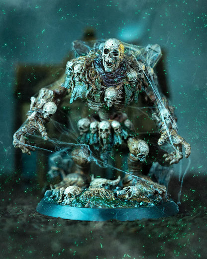 Fully painted Tombstone Golem front view with spiderwebs, skull-covered torso, and tombstone shoulder detail.