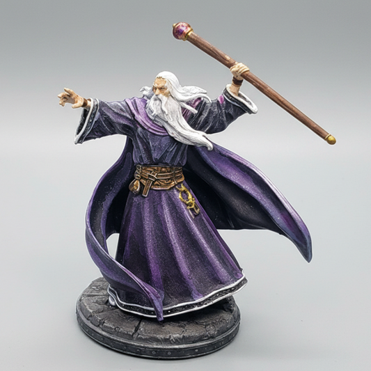 Custom painted by D&K Custom Prints of the 32mm variant of Archbauld Human Wizard in flowing robes holding a long arcane staff.