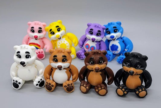collection of articulated baby bear fidget toys in multiple colors displayed together showing different styles and designs on gray background