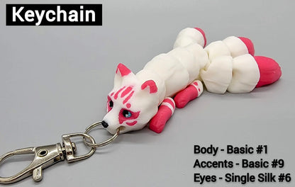 Pink and white 3D printed articulated kitsune keychain toy