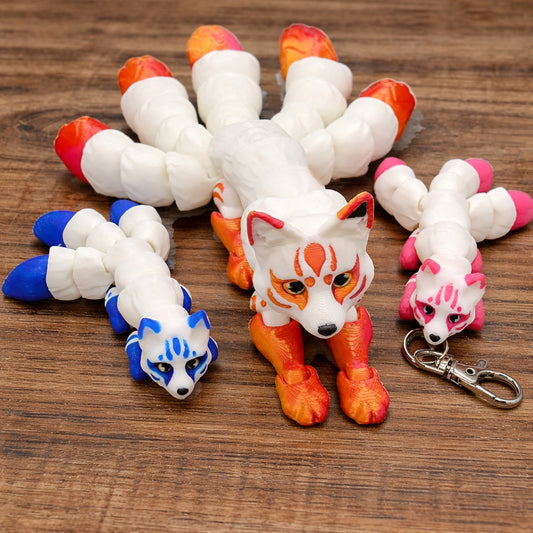 3D printed articulated kitsune toys in various sizes and custom colors